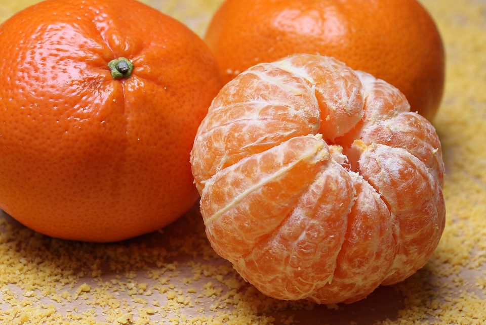 three orange fruits