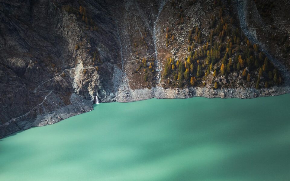 a mountain near green water
