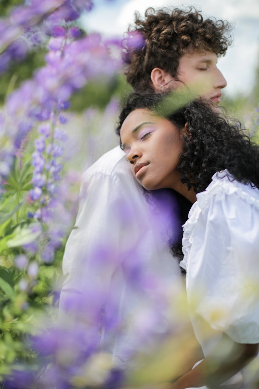 woman in white long sleeve shirt beside girl in purple shirt