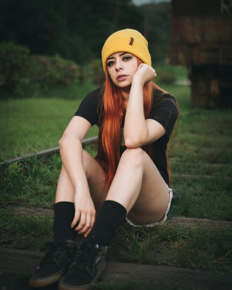 photo of woman wearing yellow beanie