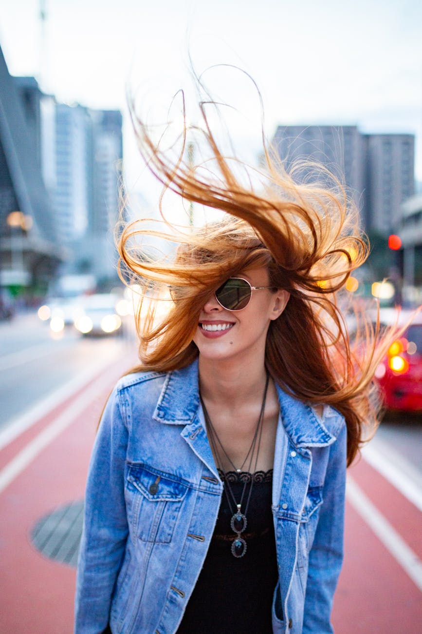 woman smiling on selective focus photography