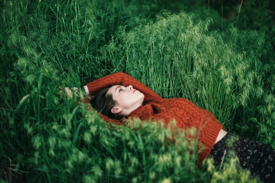 woman lying on grass