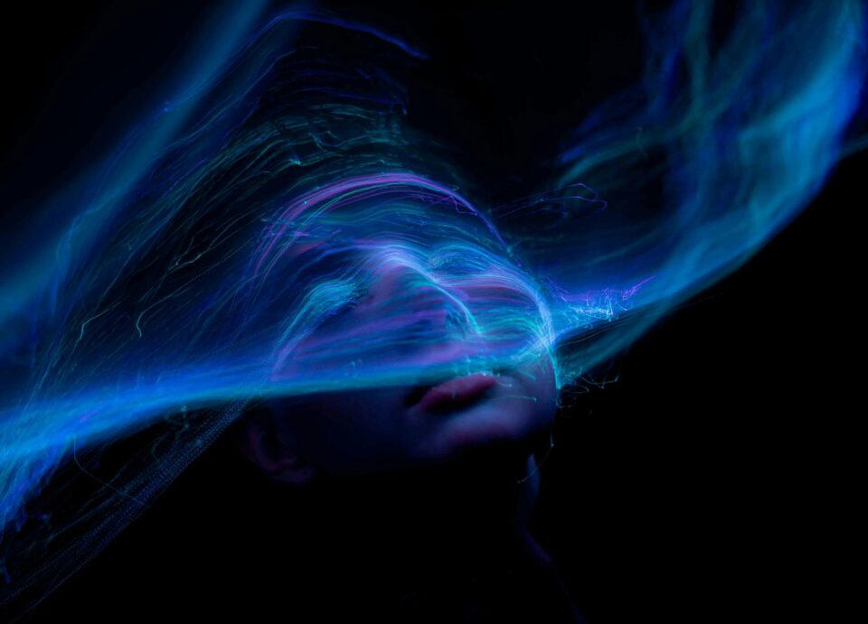 a blue face glowing