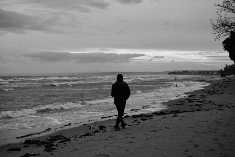 solitary walk on a winter beach