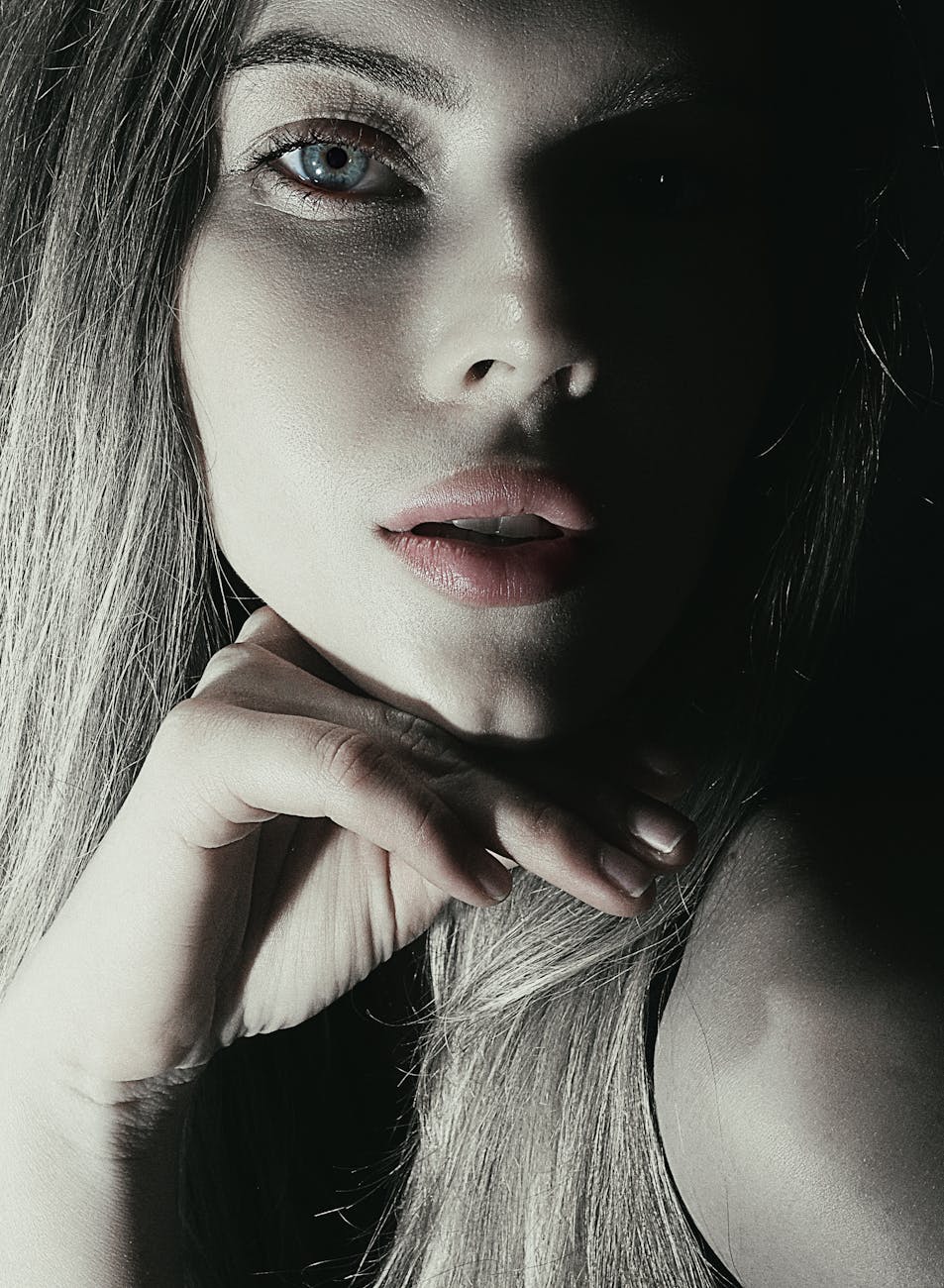 dramatic black and white portrait of woman