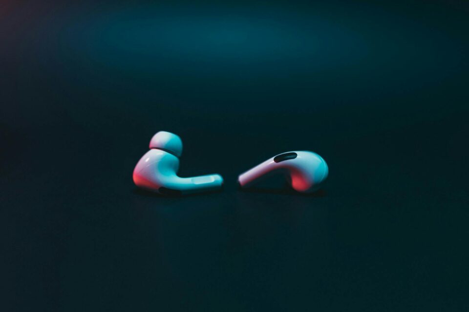pink and white plastic earphones
