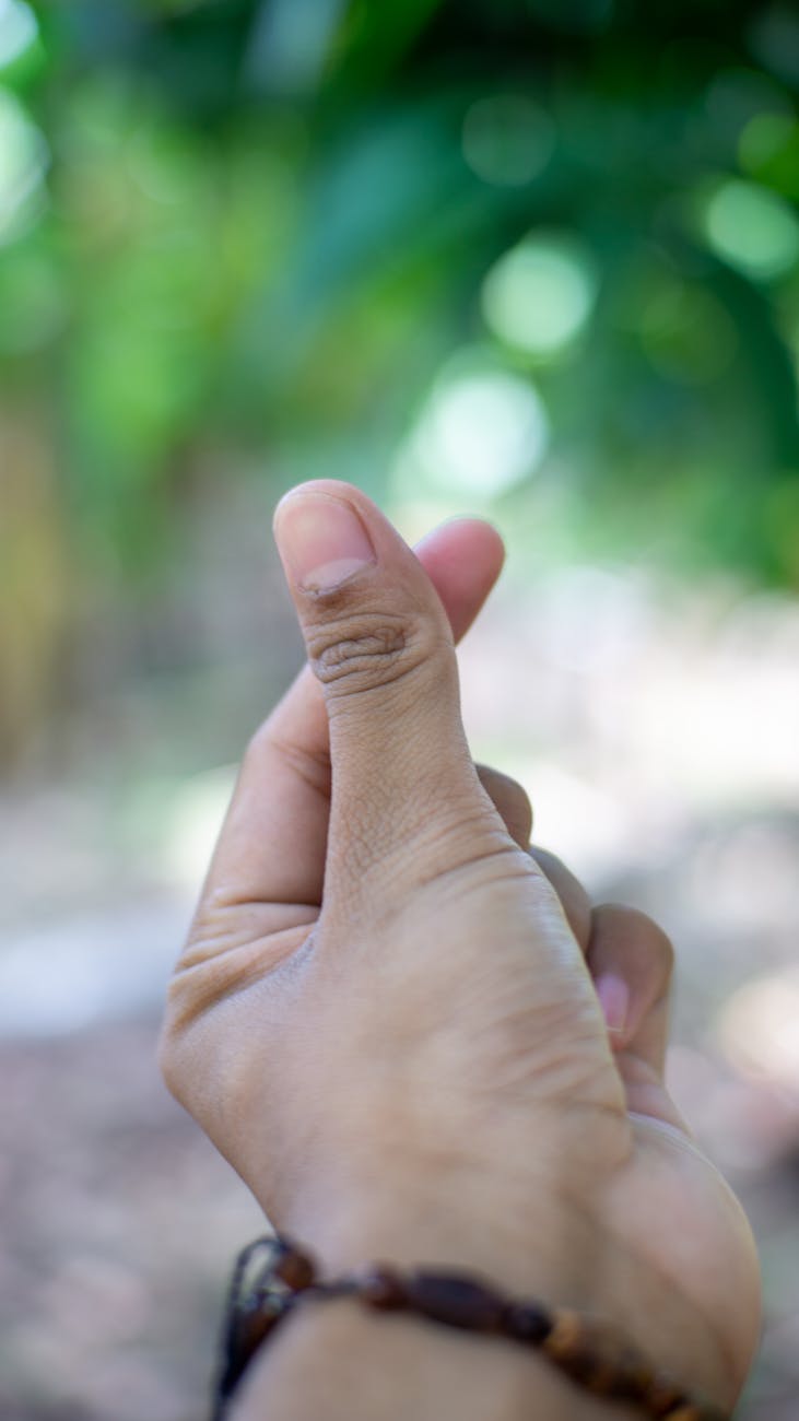 close up of heart hand sign