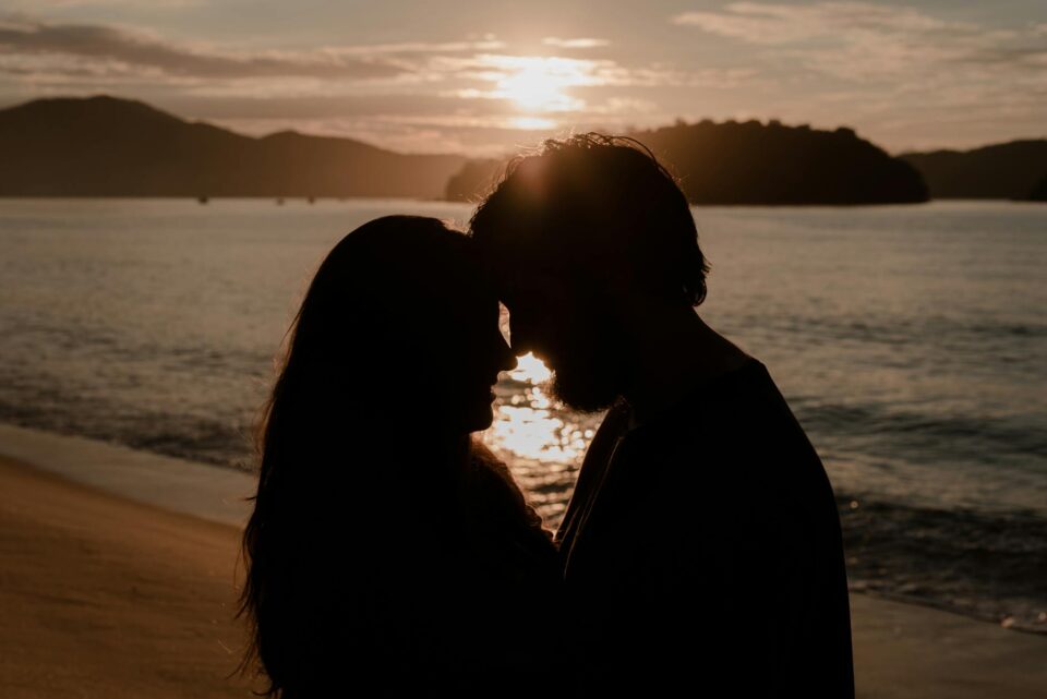 silhouettes of a man and a woman head to head