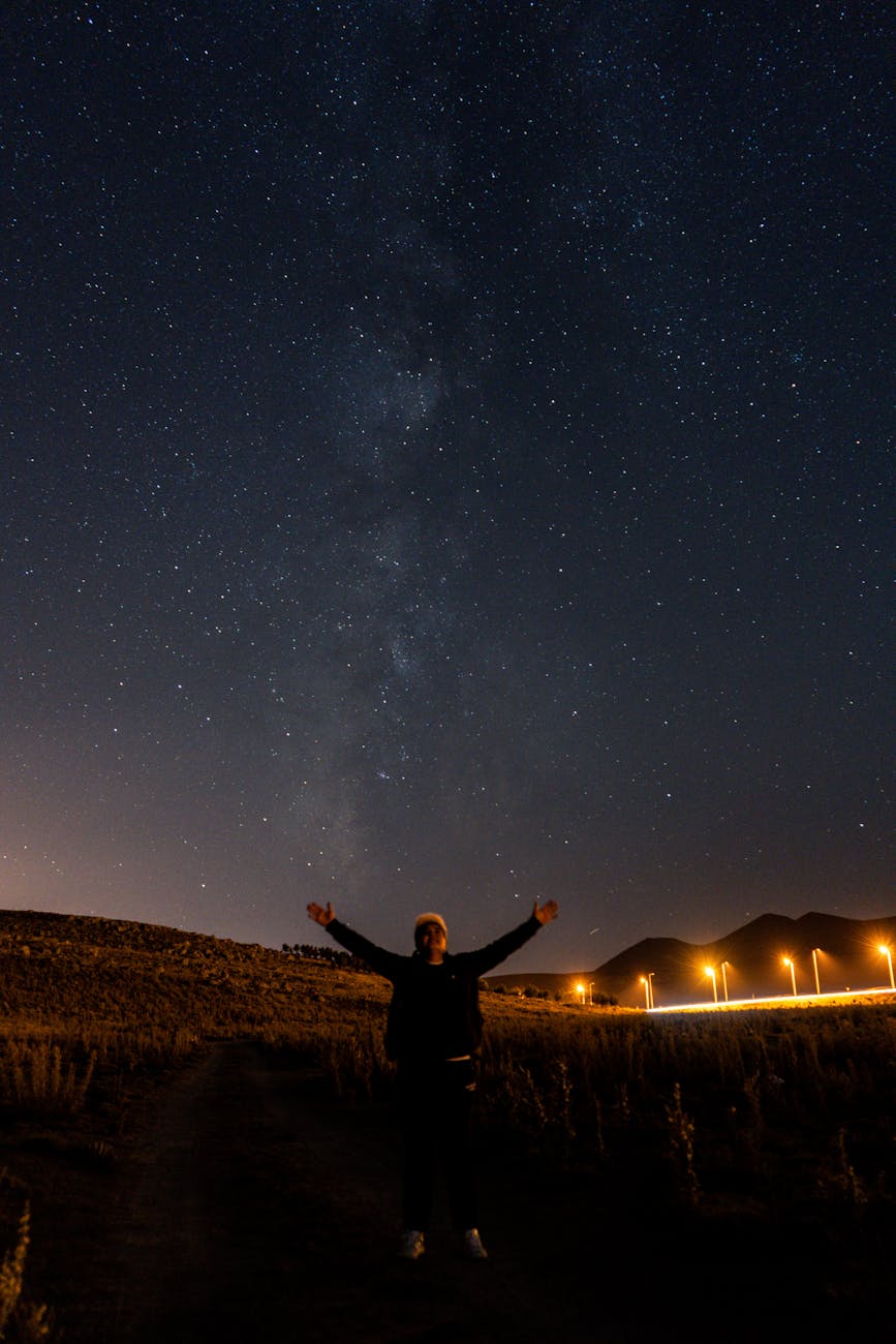 stargazer under a starry night sky