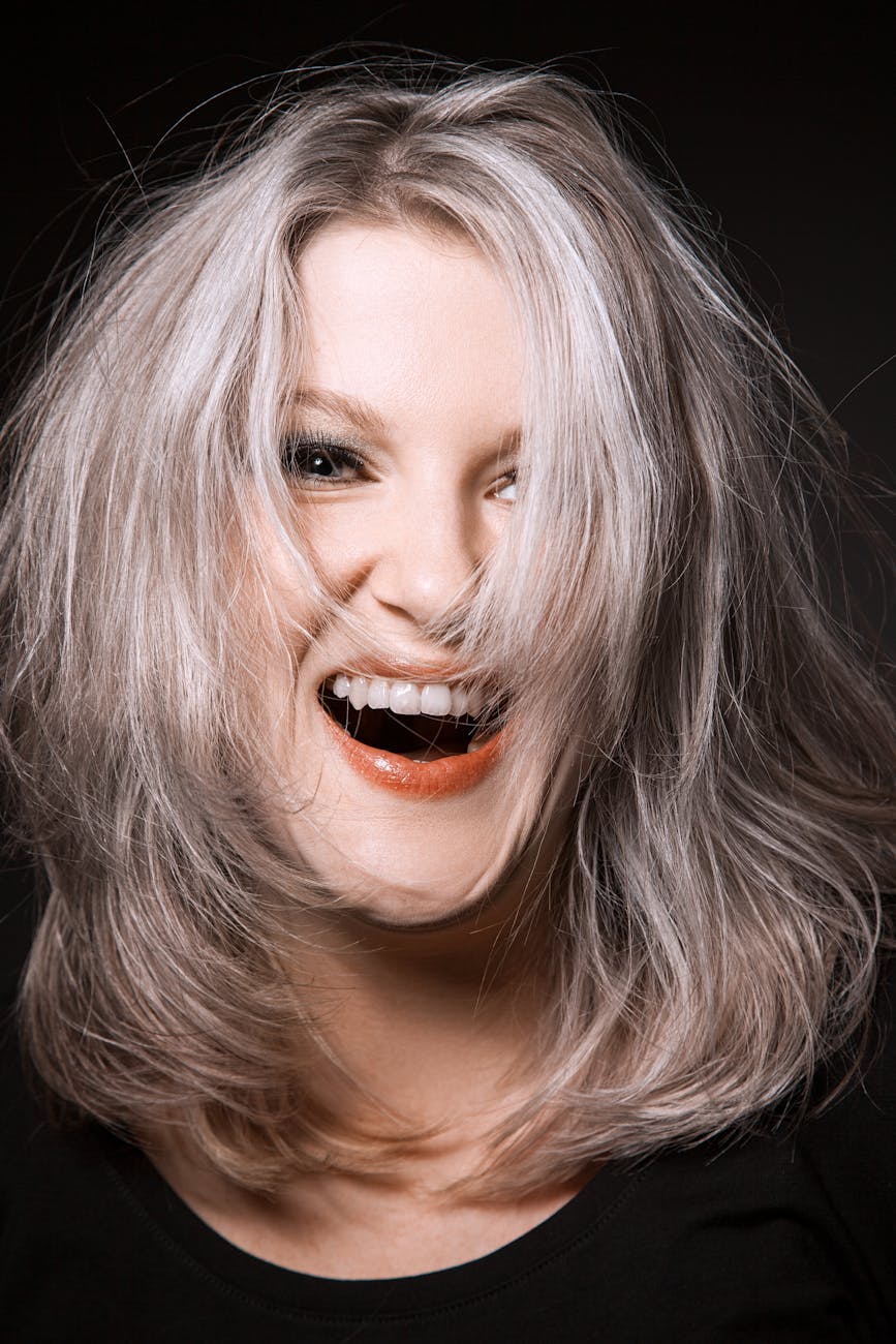 woman with red lips laughing