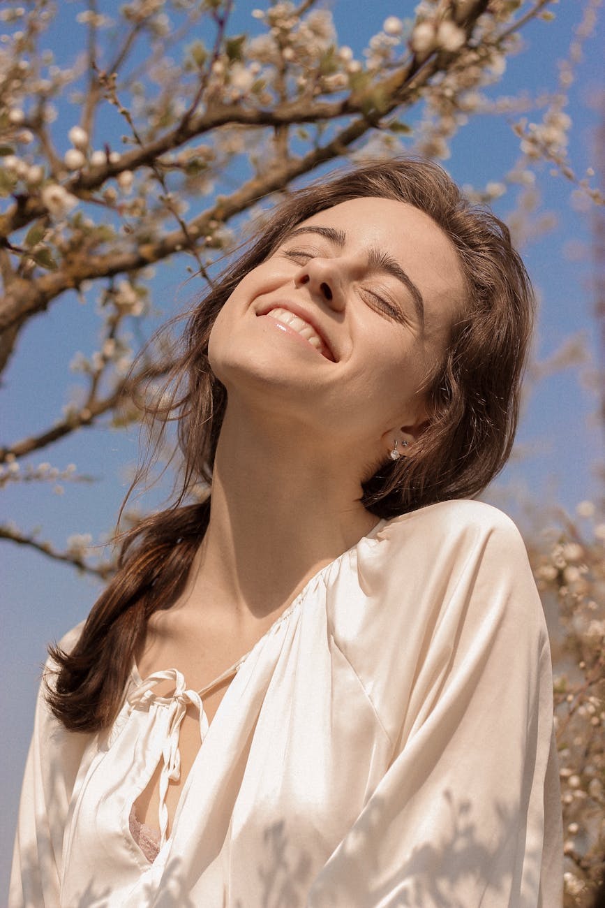 a portrait of a happy woman in a white blouse