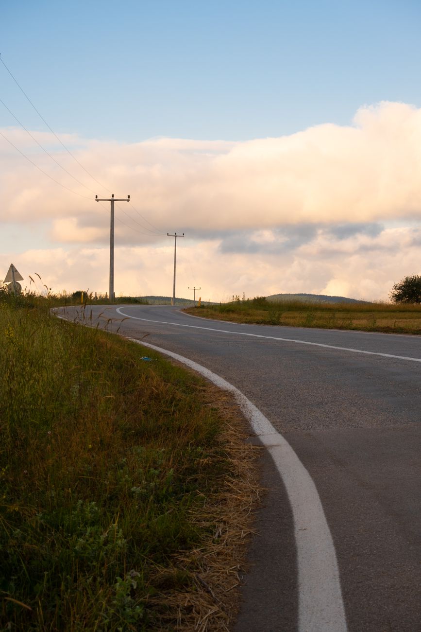 concrete road under the cloudy sky