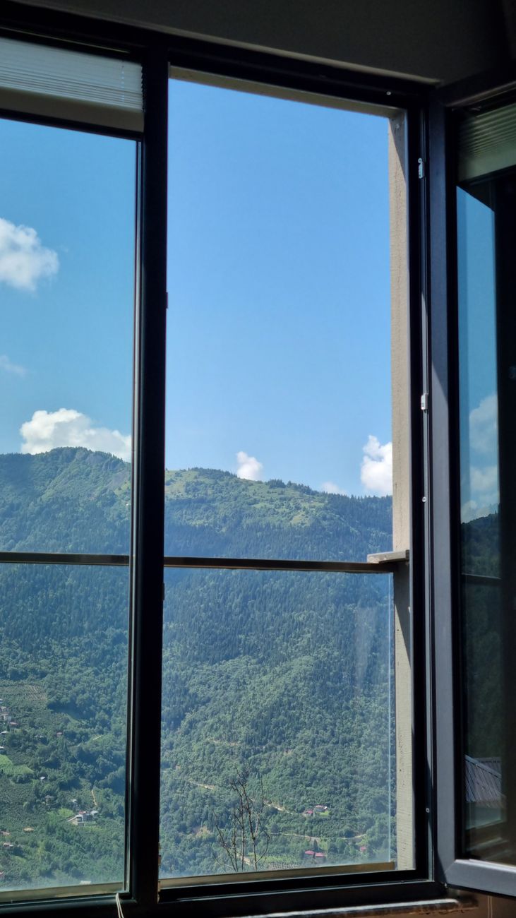 window with a view of a mountain