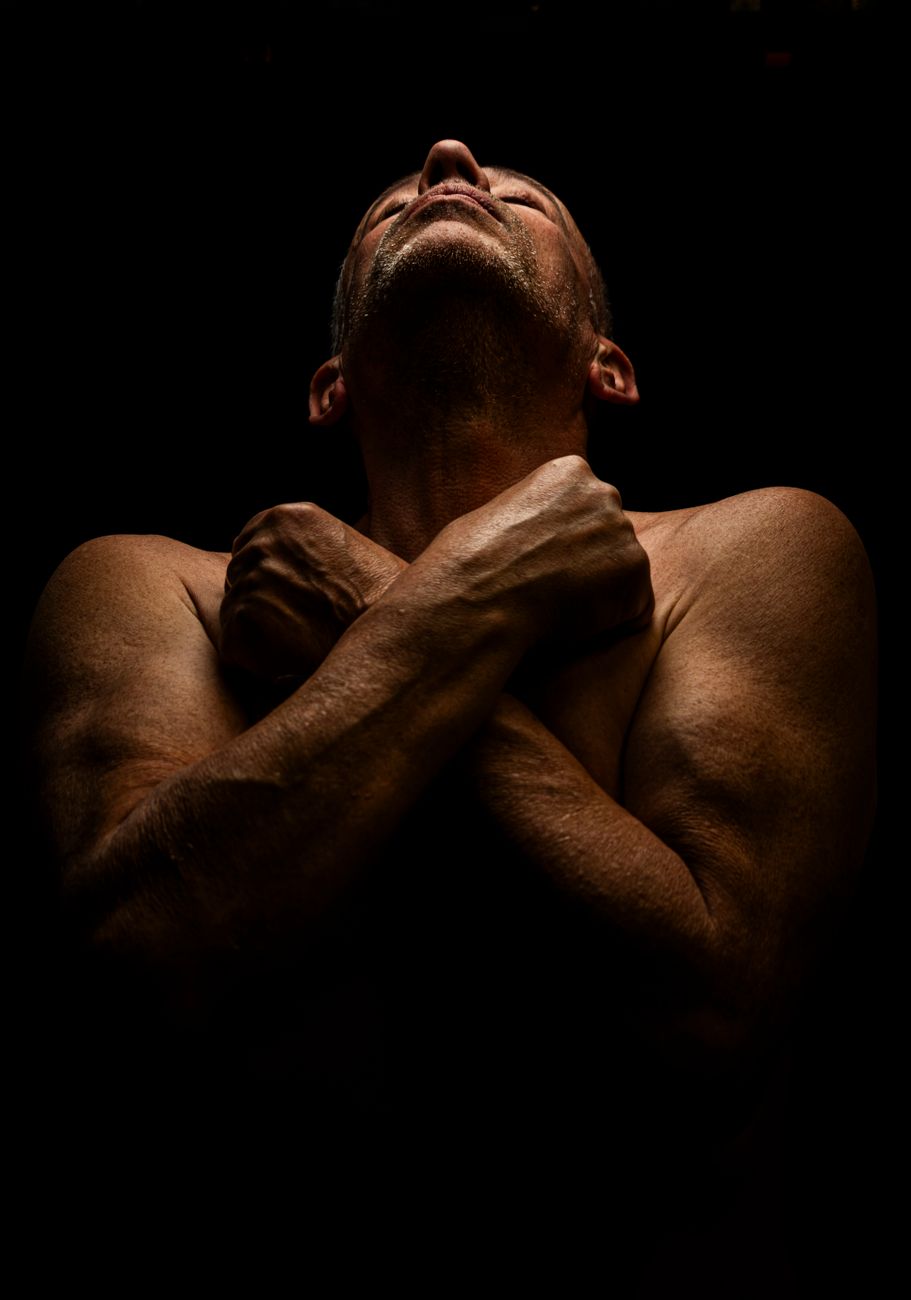 dramatic low light portrait of contemplative man